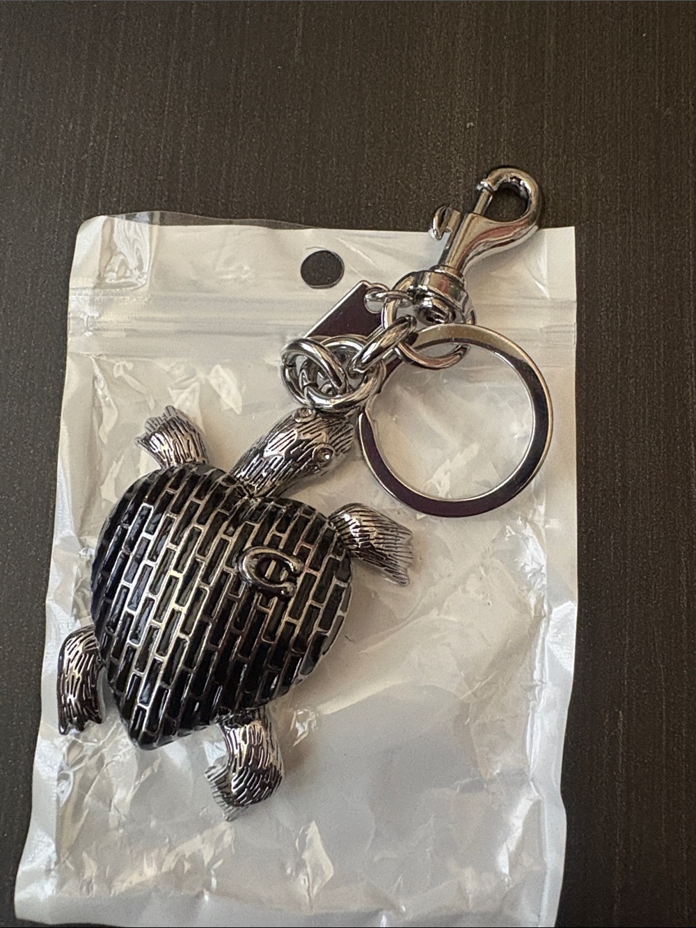 Silver Turtle Keychain with Embossed 'C' Logo